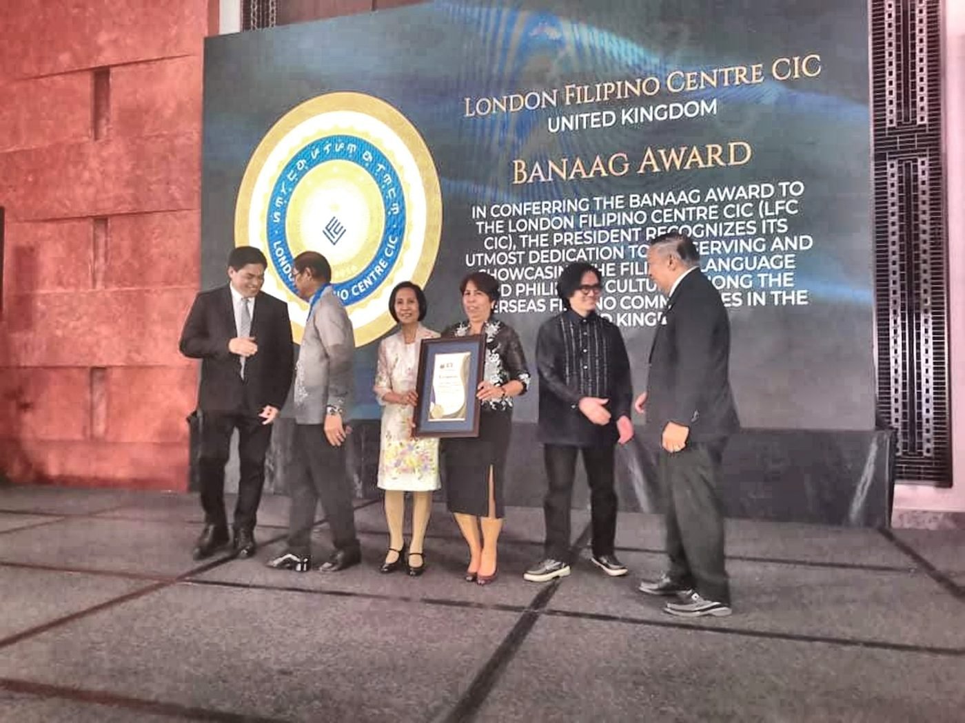 LFC representatives on stage receiving the Presidential Banaag Award.