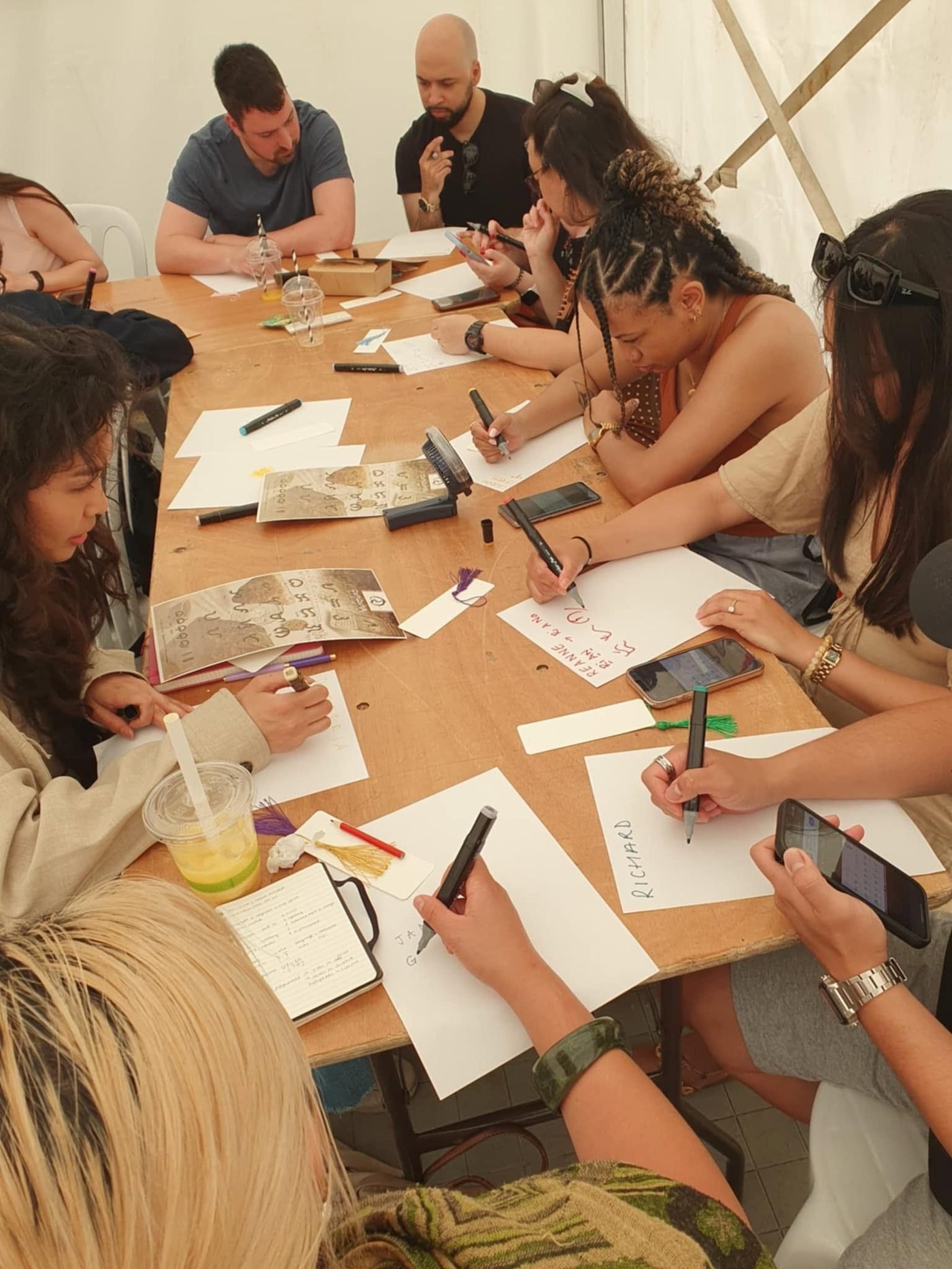 Learners writing Baybayin at UCL FiliFest, Stratford.